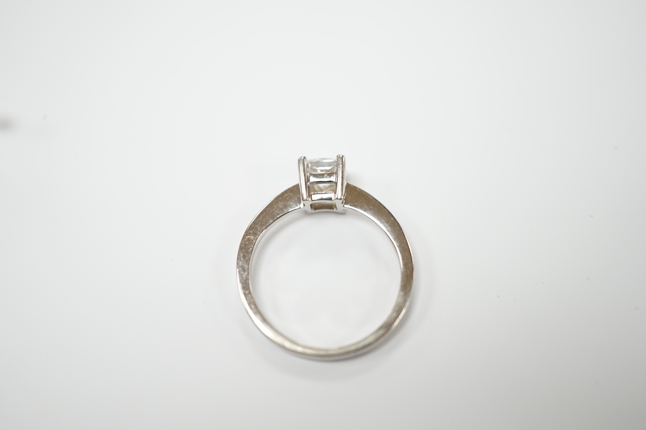 A white metal and princess cut solitaire diamond set ring, the stone weighing 0.50ct, size K, gross weight 3.4 grams.
